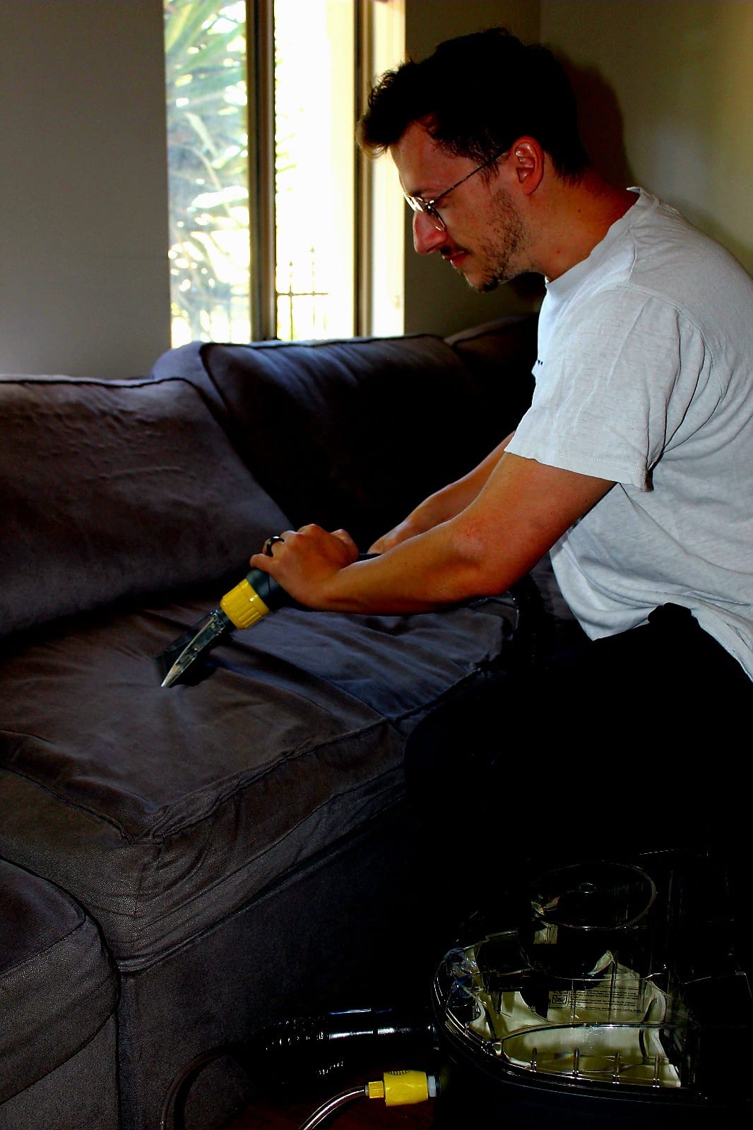MisterClean manager deep-cleaning a sofa