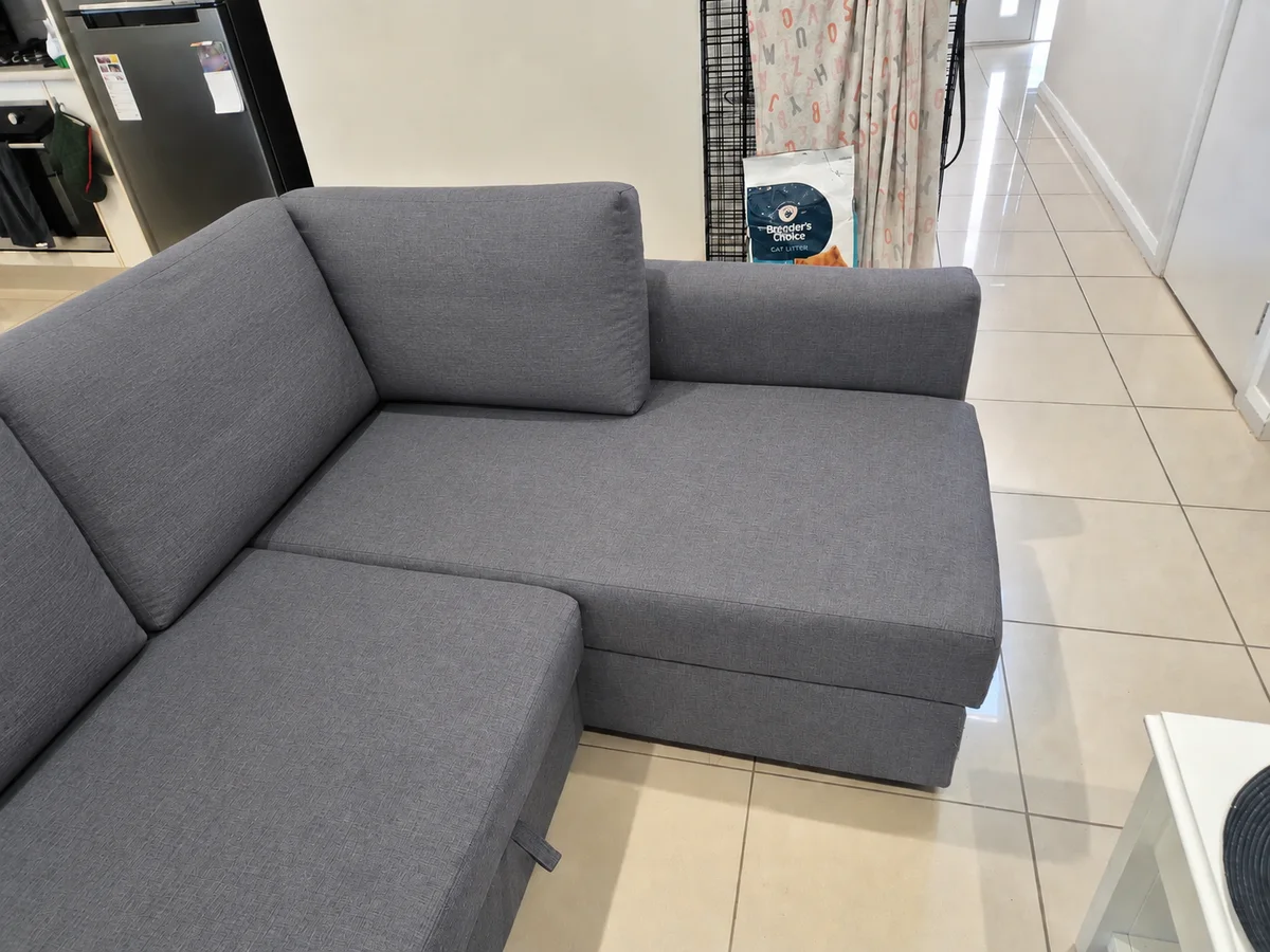 The same grey chaise seat and back cushion after deep cleaning
