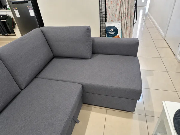 The same grey chaise seat and back cushion after cleaning