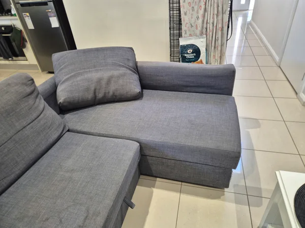 Grey chaise seat and back cushion before cleaning