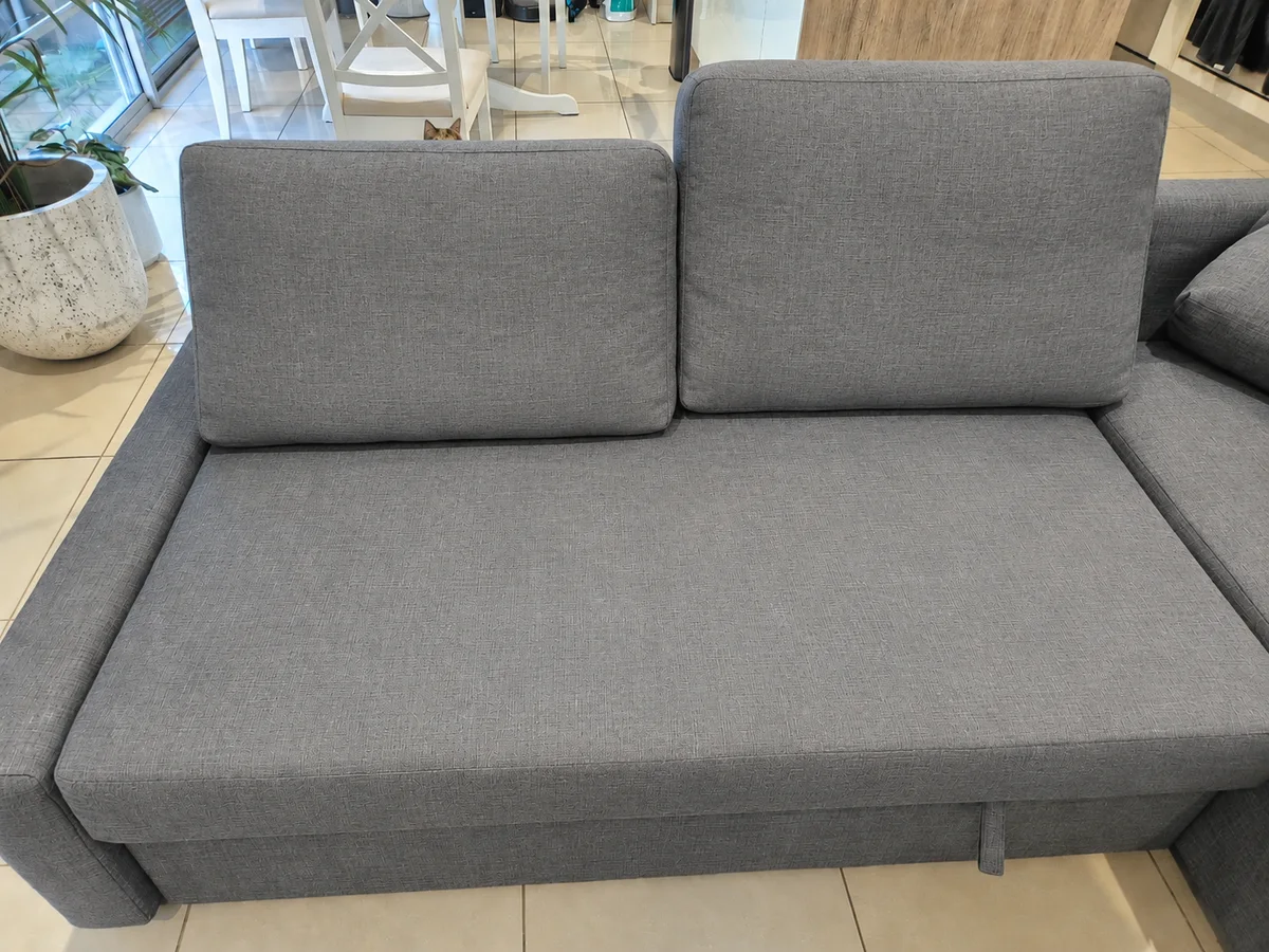 The same grey sofa after professional upholstery cleaning
