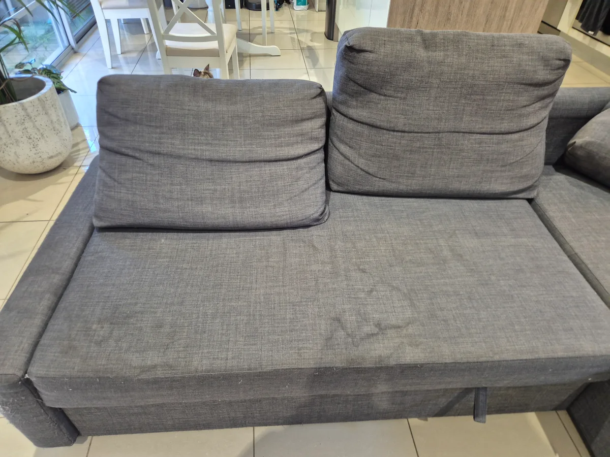 Grey sofa before professional upholstery cleaning